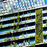Office building with vertical gardens and heliostats