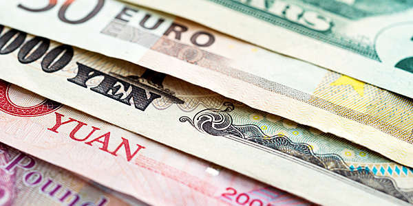 Close-up of international currency notes.