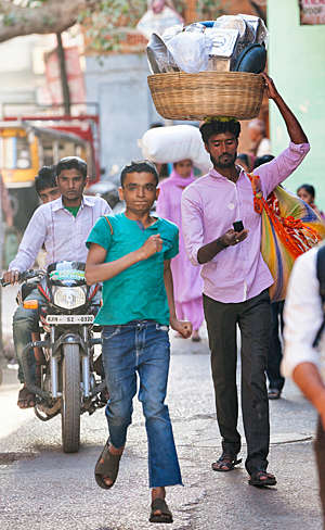 Busy street view of people going about their daily business in Sardar Market, Jodhpur, India.